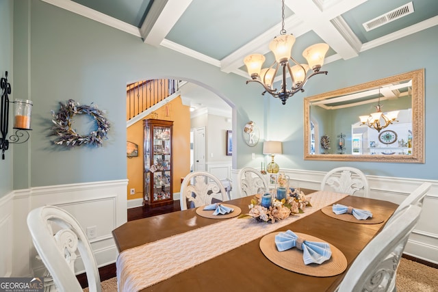 dining room featuring beamed ceiling, crown molding, and coffered ceiling