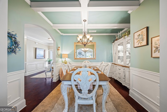 dining room featuring beamed ceiling, a healthy amount of sunlight, dark wood-type flooring, and coffered ceiling