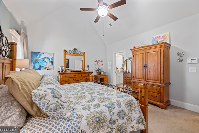 carpeted bedroom featuring ceiling fan, high vaulted ceiling, and ensuite bath