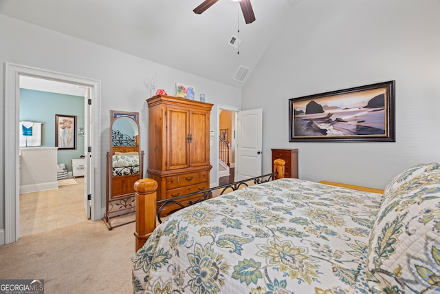 bedroom with ceiling fan, light colored carpet, and high vaulted ceiling