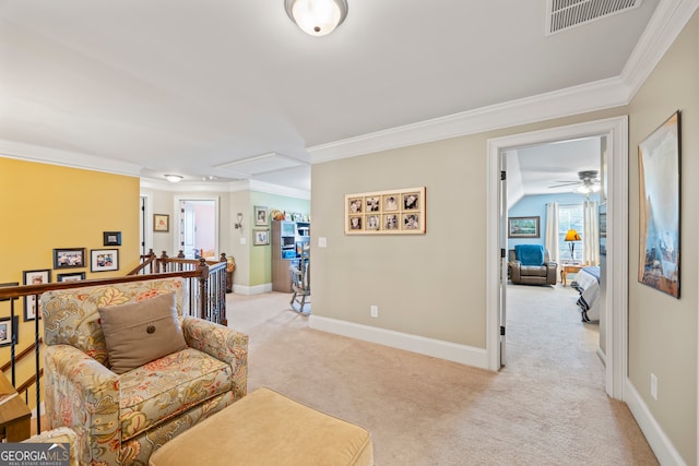 living area with light colored carpet and ornamental molding