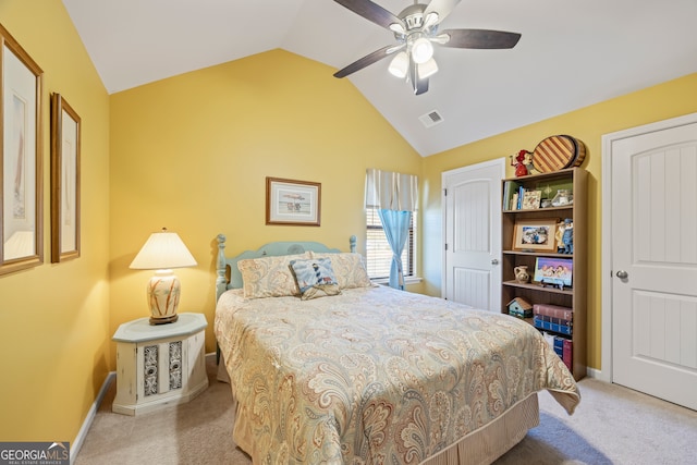 bedroom featuring light carpet, vaulted ceiling, and ceiling fan