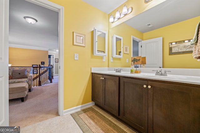 bathroom featuring tile patterned flooring and vanity