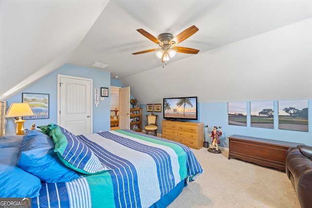 bedroom with carpet flooring, ceiling fan, and vaulted ceiling