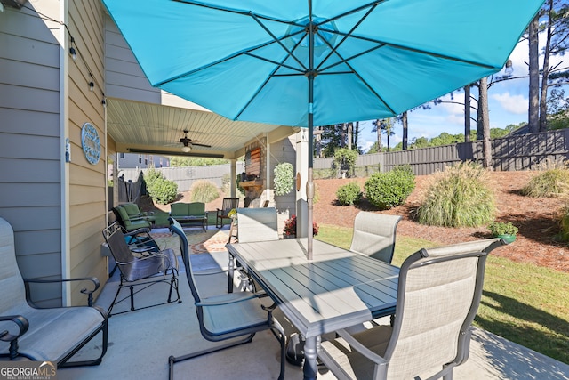 view of patio / terrace featuring ceiling fan and an outdoor living space