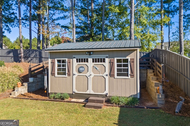 view of outdoor structure with a yard