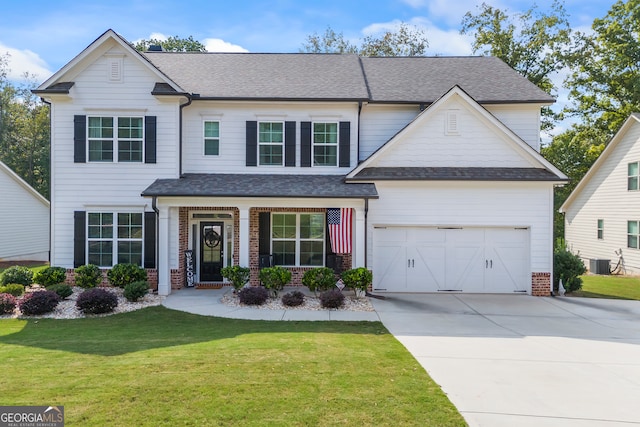 view of front of property with central AC unit, a porch, a garage, and a front lawn