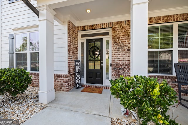 property entrance featuring covered porch