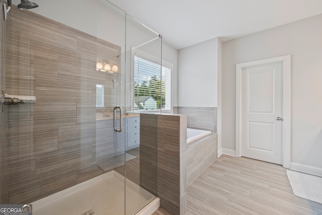 bathroom featuring plus walk in shower