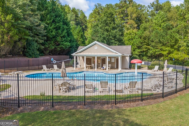 view of swimming pool featuring a patio area