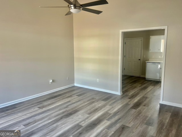 empty room with ceiling fan and hardwood / wood-style flooring