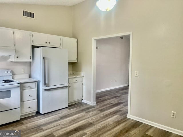 kitchen with white appliances, white cabinets, lofted ceiling, light hardwood / wood-style flooring, and custom range hood