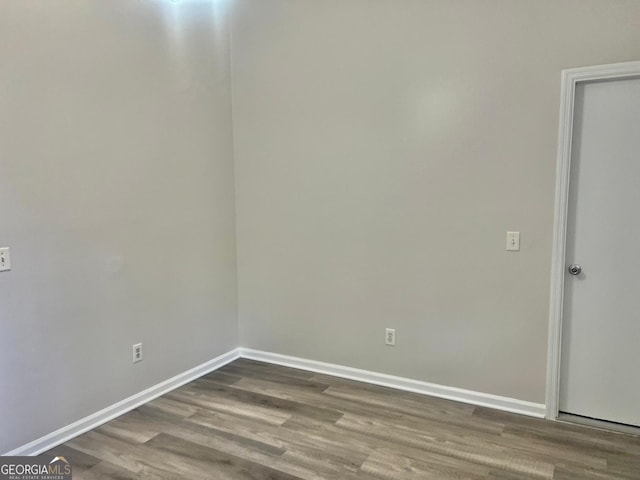 empty room featuring hardwood / wood-style floors