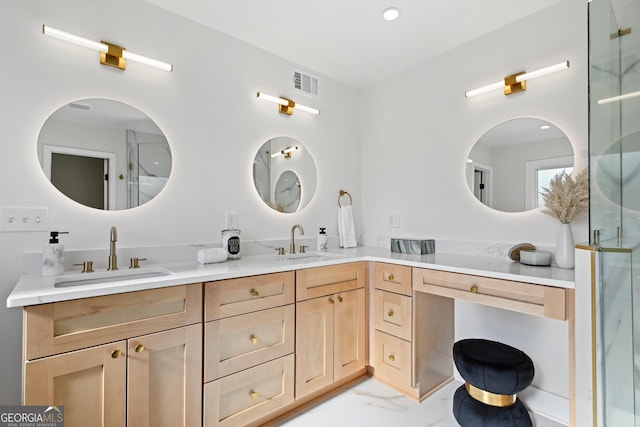 bathroom with vanity and a shower with door