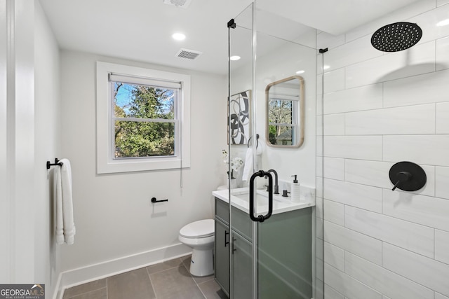 bathroom featuring an enclosed shower and toilet