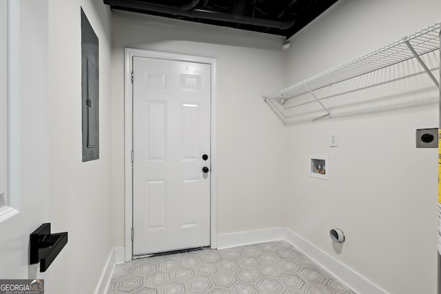 laundry room with hookup for a washing machine, light tile patterned flooring, electric dryer hookup, and electric panel