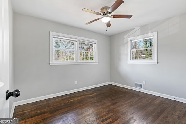 unfurnished room featuring ceiling fan and dark hardwood / wood-style flooring