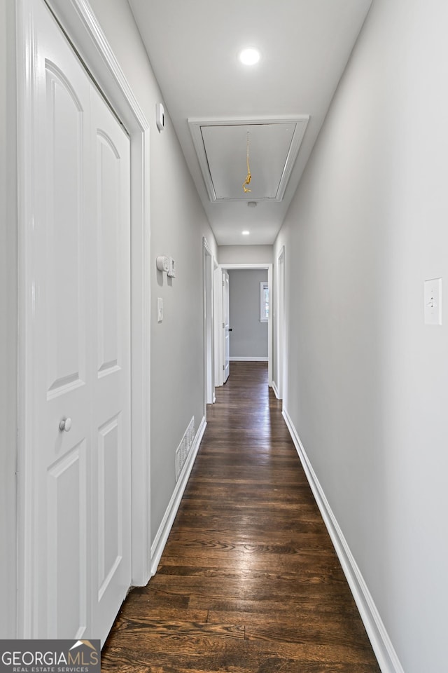 corridor featuring dark hardwood / wood-style floors