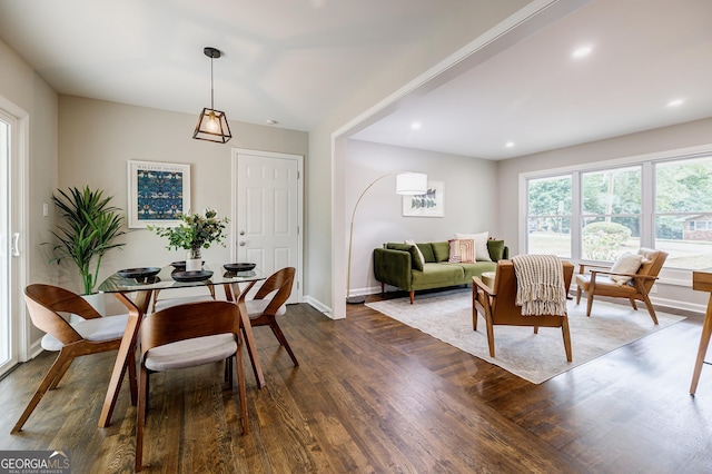 dining area with dark hardwood / wood-style floors