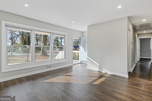 spare room with dark hardwood / wood-style flooring