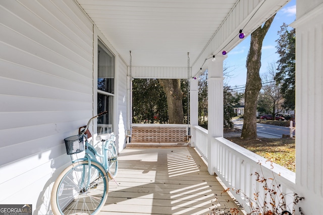 wooden terrace featuring a porch