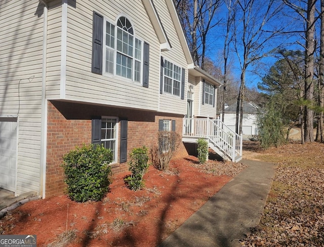 view of side of home featuring a garage