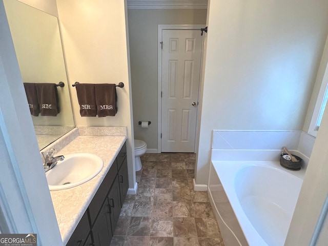 bathroom with vanity, toilet, and a bathtub