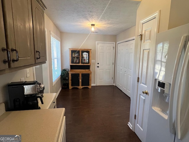 interior space featuring dark hardwood / wood-style floors and a textured ceiling