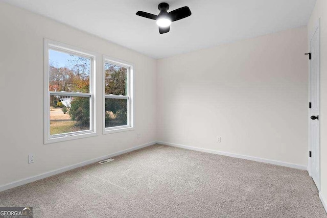 unfurnished room featuring carpet and ceiling fan