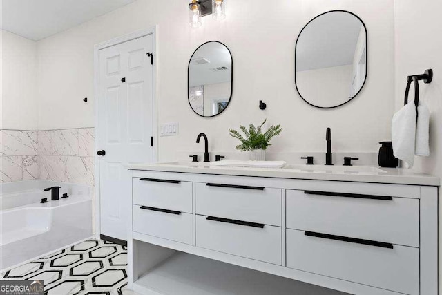 bathroom featuring a washtub and vanity