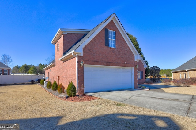 view of property exterior with central AC and a garage