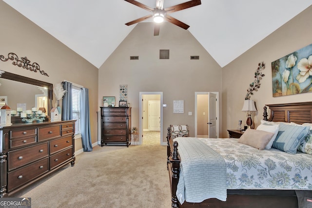 bedroom with ceiling fan, high vaulted ceiling, and light colored carpet