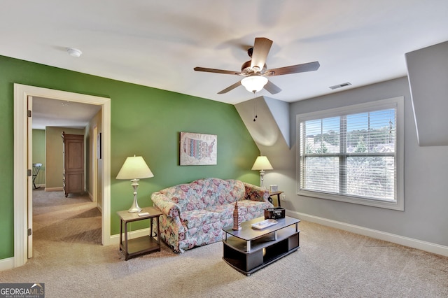 living room with ceiling fan and light carpet