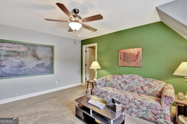 carpeted living room with ceiling fan