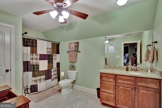 bathroom featuring vanity, vaulted ceiling, ceiling fan, toilet, and curtained shower