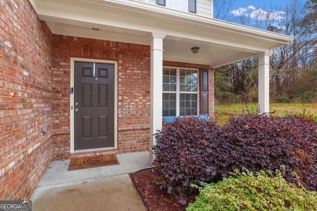 doorway to property featuring covered porch