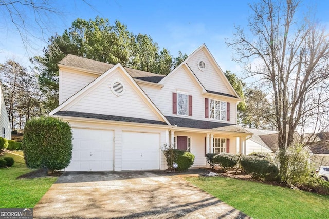 front of property with a garage