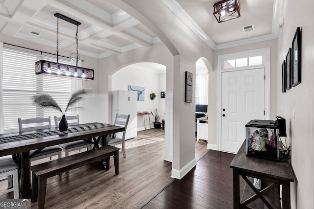 entryway featuring beam ceiling, dark wood-type flooring, ornamental molding, and coffered ceiling