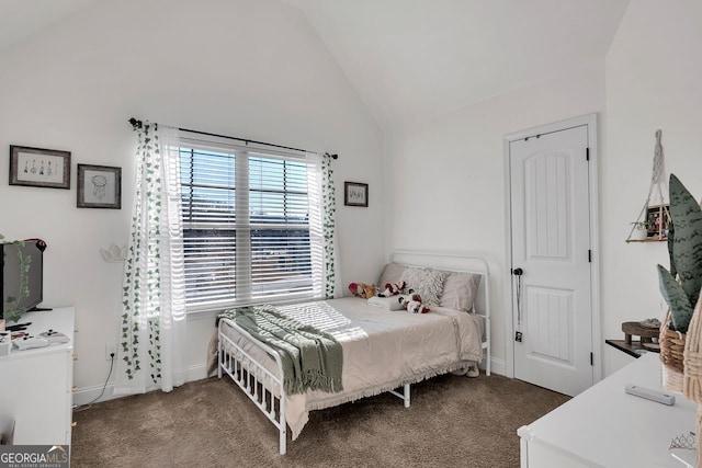 carpeted bedroom featuring high vaulted ceiling