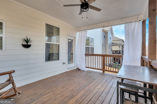 wooden deck with ceiling fan