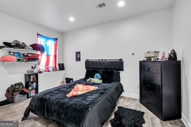 bedroom featuring light hardwood / wood-style floors