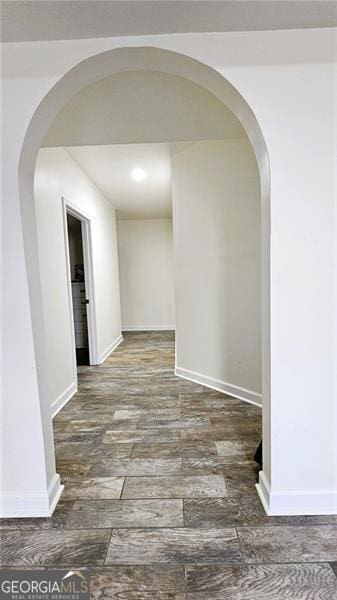 hall with dark hardwood / wood-style flooring