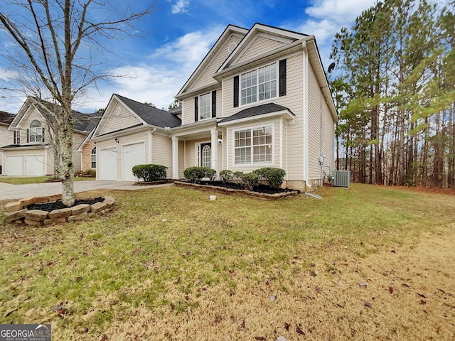 view of front property featuring cooling unit, a front lawn, and a garage