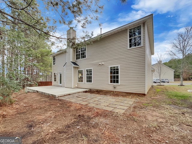 rear view of house with a patio