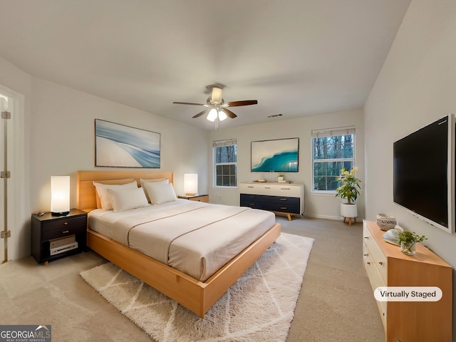 bedroom with ceiling fan and carpet floors