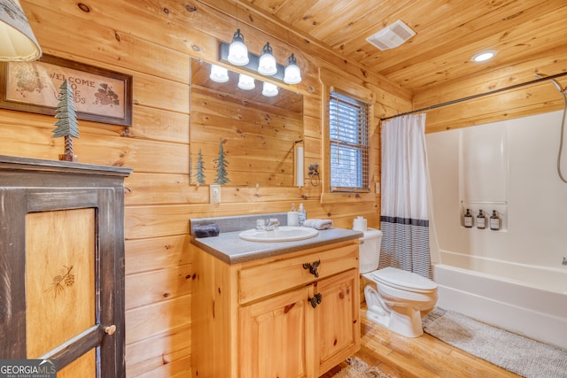 full bathroom featuring vanity, wood walls, hardwood / wood-style flooring, toilet, and wood ceiling