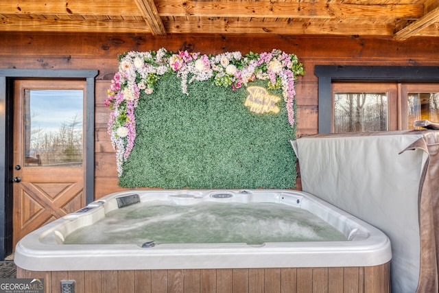 bathroom with beam ceiling and wood ceiling