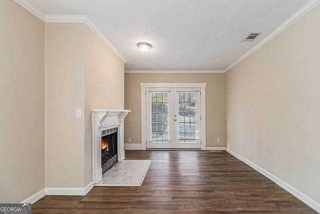 unfurnished living room with dark hardwood / wood-style flooring, french doors, and ornamental molding