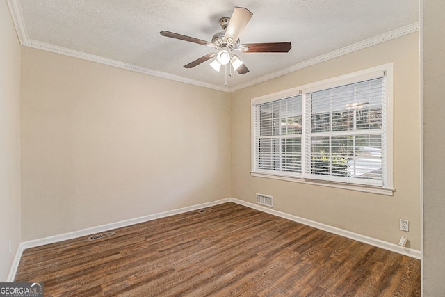 empty room featuring ceiling fan, dark hardwood / wood-style flooring, crown molding, and a textured ceiling