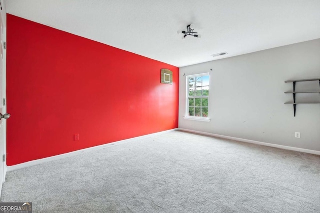 empty room featuring carpet flooring